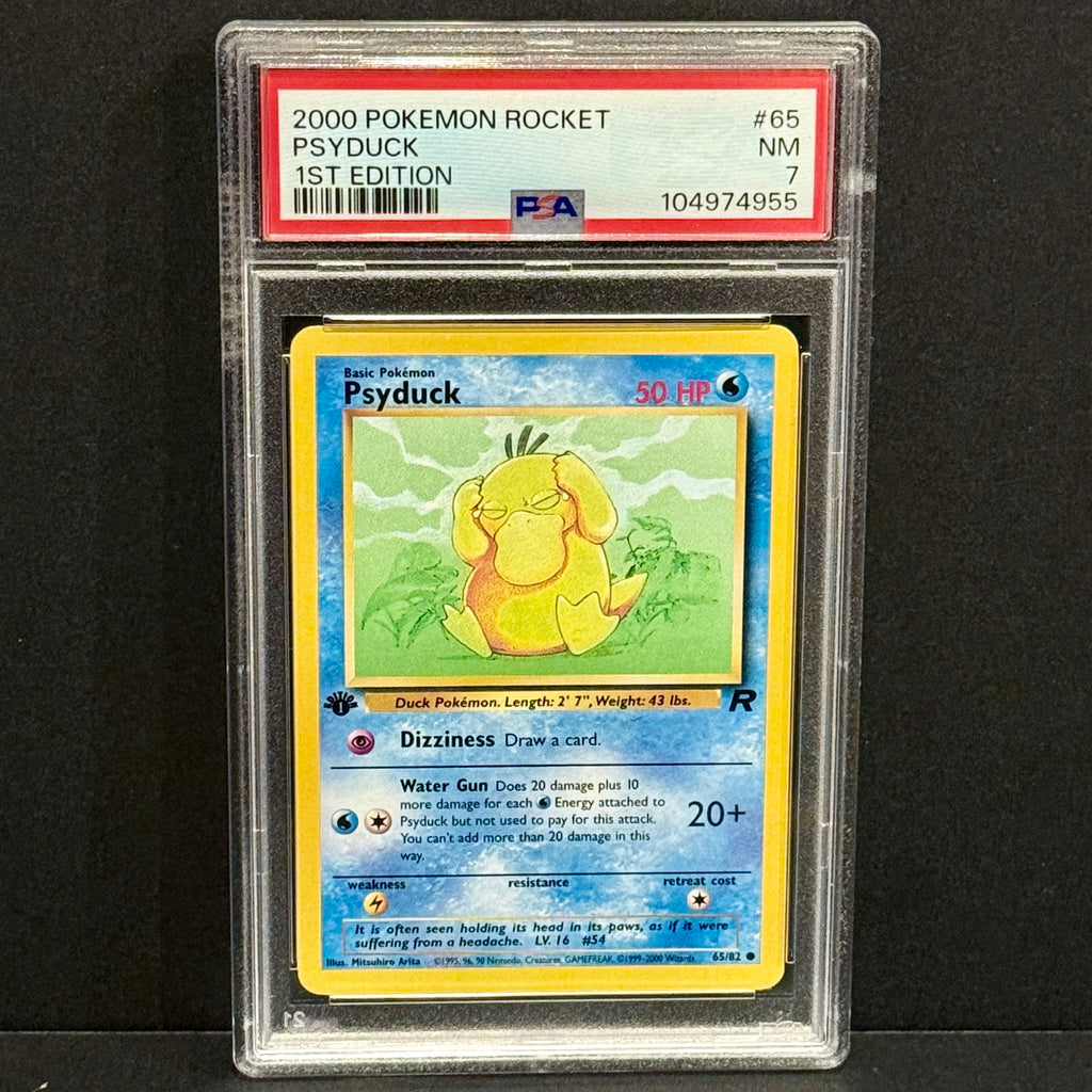2000 Pokemon Team Rocket 065/082 Psyduck Common 1st Edition PSA 7
