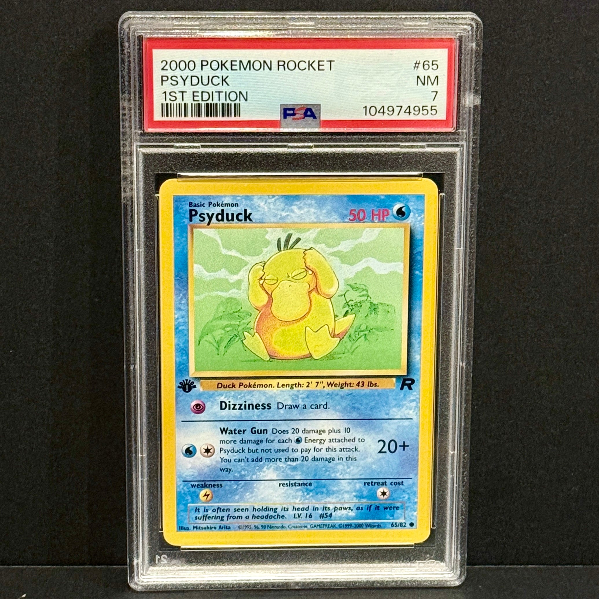 2000 Pokemon Team Rocket 065/082 Psyduck Common 1st Edition PSA 7